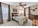Bedroom with two windows, a ceiling fan, and a bed with shark-themed pillows and patterned blanket at 1227 Cypress Shadow Ct., Murrells Inlet, SC 29576
