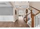 Inviting entryway featuring hardwood floors, elegant staircase, and a view into the living spaces at 1227 Cypress Shadow Ct., Murrells Inlet, SC 29576