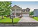 Charming two-story home with a inviting front porch, a well-manicured lawn and a two car garage at 1227 Cypress Shadow Ct., Murrells Inlet, SC 29576