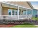 Covered outdoor porch area for relaxing and perfect sun orientation during hot summer months at 1227 Cypress Shadow Ct., Murrells Inlet, SC 29576