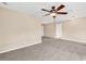 Large bonus room with neutral paint and carpeted floors; ceiling fan included at 126 Dreamland Dr., Murrells Inlet, SC 29576