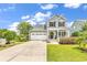 Charming two-story home with a two-car garage, landscaped yard, and welcoming front porch at 126 Dreamland Dr., Murrells Inlet, SC 29576