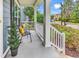Welcoming front porch features comfortable seating and attractive landscaping, offering a charming entrance at 126 Dreamland Dr., Murrells Inlet, SC 29576