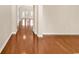A hallway featuring beautiful hardwood floors and open archways that lead into well-lit rooms at 126 Dreamland Dr., Murrells Inlet, SC 29576