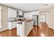 Modern kitchen with white cabinets, granite countertops, stainless steel appliances, and hardwood floors at 126 Dreamland Dr., Murrells Inlet, SC 29576