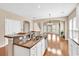 Open-concept kitchen with granite countertops, stainless steel appliances, and hardwood floors at 126 Dreamland Dr., Murrells Inlet, SC 29576
