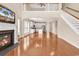 Inviting living room featuring a fireplace, hardwood floors, and access to a modern kitchen at 126 Dreamland Dr., Murrells Inlet, SC 29576