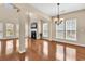 Inviting living room features hardwood floors, a fireplace, and multiple windows for ample natural light at 126 Dreamland Dr., Murrells Inlet, SC 29576