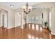 Bright living room with hardwood floors, a fireplace, and large windows that offer plenty of natural light at 126 Dreamland Dr., Murrells Inlet, SC 29576
