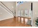 Bright living room boasts hardwood floors, a soaring ceiling, and abundant natural light at 126 Dreamland Dr., Murrells Inlet, SC 29576