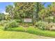 Well-maintained Creek Haven community sign is surrounded by mature landscaping and lush greenery at 126 Dreamland Dr., Murrells Inlet, SC 29576