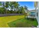 Spacious backyard with a well-maintained lawn, fence, and patio area perfect for outdoor activities at 1331 Winding Creek Way, Myrtle Beach, SC 29588