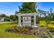Decorative community sign with lush landscaping and clear skies at 1331 Winding Creek Way, Myrtle Beach, SC 29588
