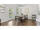 Bright dining area with a modern table, artwork, and a view of the backyard at 1331 Winding Creek Way, Myrtle Beach, SC 29588
