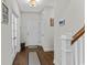 Welcoming entryway with hardwood floors, white staircase and neutral decor at 1331 Winding Creek Way, Myrtle Beach, SC 29588
