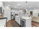 Bright kitchen with stainless steel appliances, an island with seating, and modern fixtures at 1331 Winding Creek Way, Myrtle Beach, SC 29588