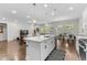 Bright kitchen with a large island, stainless appliances, and an open-concept design at 1331 Winding Creek Way, Myrtle Beach, SC 29588