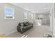 Cozy living area featuring a comfortable sofa, sunlit windows, and neutral decor at 1331 Winding Creek Way, Myrtle Beach, SC 29588