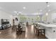 Open-concept living room features hardwood floors, neutral tones, and kitchen bar at 1331 Winding Creek Way, Myrtle Beach, SC 29588