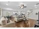 Bright open-concept living room with hardwood floors, white cabinets, and a ceiling fan at 1331 Winding Creek Way, Myrtle Beach, SC 29588