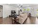 Spacious living room boasts hardwood floors, a ceiling fan and abundant natural light at 1331 Winding Creek Way, Myrtle Beach, SC 29588