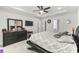 Well-lit main bedroom featuring a tray ceiling, ceiling fan, and plush carpet flooring at 1331 Winding Creek Way, Myrtle Beach, SC 29588