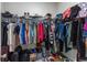 Walk-in closet filled with an extensive collection of clothing, shoes, and accessories at 1331 Winding Creek Way, Myrtle Beach, SC 29588