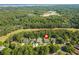 An aerial view showing the home's location near a golf course, trees, and water at 168 Mackinley Circle, Pawleys Island, SC 29585