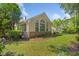Beautiful backyard featuring mature trees and manicured landscaping at 168 Mackinley Circle, Pawleys Island, SC 29585