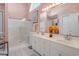 Bright bathroom with dual sinks, a walk-in shower, and ample counter space at 168 Mackinley Circle, Pawleys Island, SC 29585