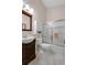 Bathroom with a single sink vanity, framed mirror, toilet and a tiled shower with glass doors at 168 Mackinley Circle, Pawleys Island, SC 29585