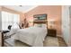 Cozy bedroom with a comfortable bed, artwork, and ample natural light from the large windows at 168 Mackinley Circle, Pawleys Island, SC 29585