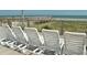 Wooden deck with ocean views, featuring lounge chairs and a tranquil spot to relax and unwind by the sea at 168 Mackinley Circle, Pawleys Island, SC 29585