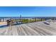 An ocean view from a wooden deck featuring plenty of seating, perfect for relaxation and enjoying the coastal breeze at 168 Mackinley Circle, Pawleys Island, SC 29585
