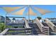 Inviting outdoor seating on the deck featuring covered outdoor seating and an ocean view at 168 Mackinley Circle, Pawleys Island, SC 29585