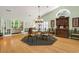 Bright dining room with hardwood floors, chandelier, and beautiful built-in cabinet at 168 Mackinley Circle, Pawleys Island, SC 29585
