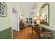 Inviting foyer with hardwood floors, light green walls, elegant decor, and a decorative gold mirror at 168 Mackinley Circle, Pawleys Island, SC 29585
