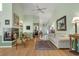 Spacious living room featuring a fireplace, hardwood floors, and plenty of natural light at 168 Mackinley Circle, Pawleys Island, SC 29585