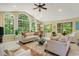 Spacious living room with vaulted ceilings, arched windows, and comfortable seating at 168 Mackinley Circle, Pawleys Island, SC 29585