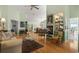 Bright and spacious living room with hardwood floors, a fireplace, and an open floor plan at 168 Mackinley Circle, Pawleys Island, SC 29585