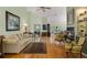 Bright and spacious living room featuring hardwood floors, a fireplace, and an open floor plan at 168 Mackinley Circle, Pawleys Island, SC 29585