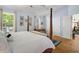 Comfortable main bedroom with a four-poster bed, hardwood floors, and ensuite access at 168 Mackinley Circle, Pawleys Island, SC 29585