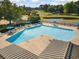 An aerial view shows a sparkling pool with ample seating, perfect for community enjoyment and relaxation at 168 Mackinley Circle, Pawleys Island, SC 29585