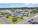 Aerial of neighborhood showcasing multiple homes and tropical greenery at 1705 N Ocean Blvd. N, North Myrtle Beach, SC 29582