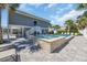 Backyard featuring pool, hot tub, lounge chairs, and covered patio offering a luxurious outdoor space at 1705 N Ocean Blvd. N, North Myrtle Beach, SC 29582