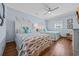 Bright bedroom featuring two cozy beds with fish-themed comforters, wood floors, and coastal decorations at 1705 N Ocean Blvd. N, North Myrtle Beach, SC 29582