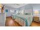 A quaint bedroom showcases two beds with cheerful striped comforters and light blue walls at 1705 N Ocean Blvd. N, North Myrtle Beach, SC 29582
