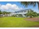 Exterior of home featuring tropical landscaping at 1705 N Ocean Blvd. N, North Myrtle Beach, SC 29582
