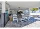 Outdoor patio with comfortable seating, grilling area, and a view of a hot tub offering a relaxing atmosphere at 1705 N Ocean Blvd. N, North Myrtle Beach, SC 29582