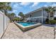 Backyard featuring a pool surrounded by a patio and lush landscaping at 1705 N Ocean Blvd. N, North Myrtle Beach, SC 29582